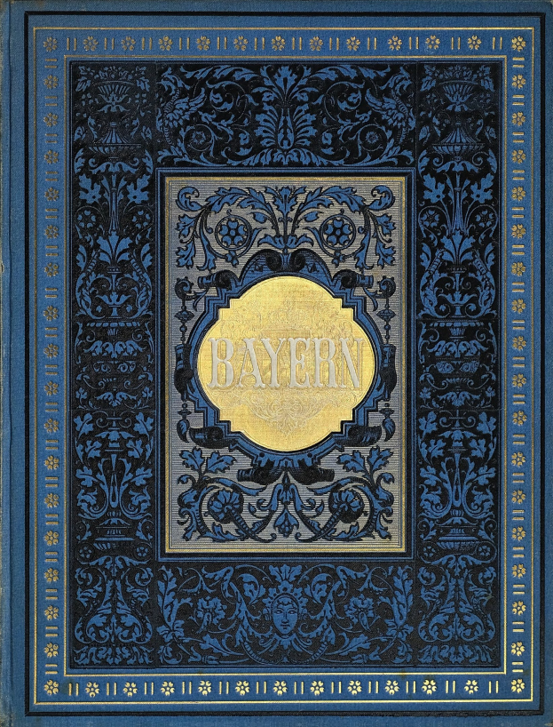 Ein blau-goldenes Buch mit der Aufschrift "Bayern" und kunstvollen Verzierungen.