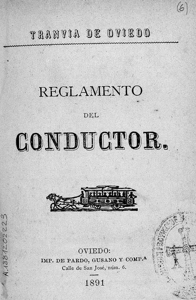 Altes Buch mit dem Titel "Reglamento de Conductor" und einer Zug-Illustration auf dem Cover sowie einem Stempel auf der rechten Seite.